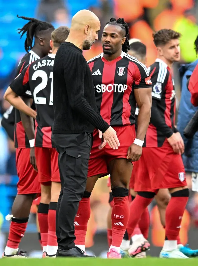 Pep Guardiola junto a Adama Traoré.