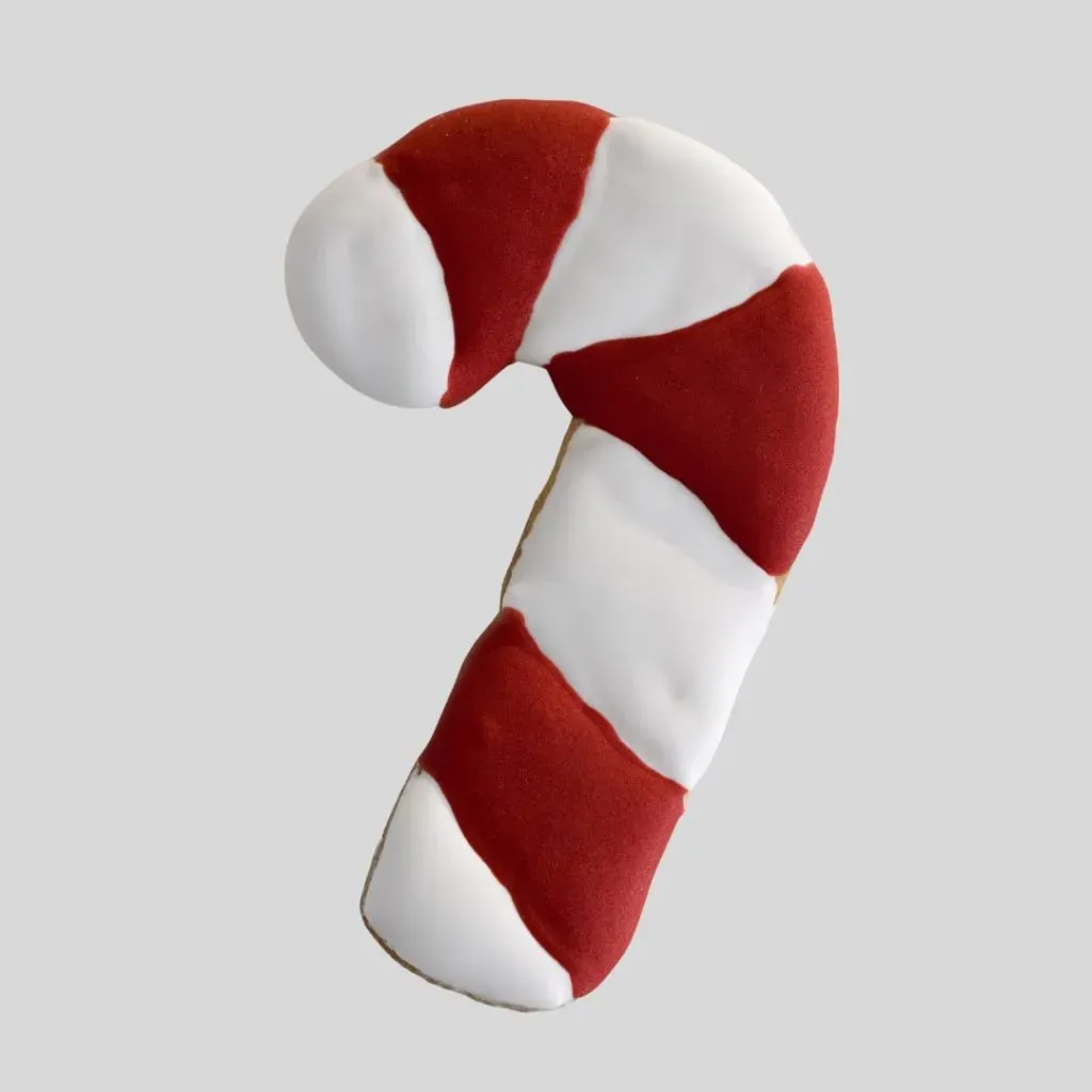 Galleta de bastón navideño decorada con glaseado rojo y blanco.