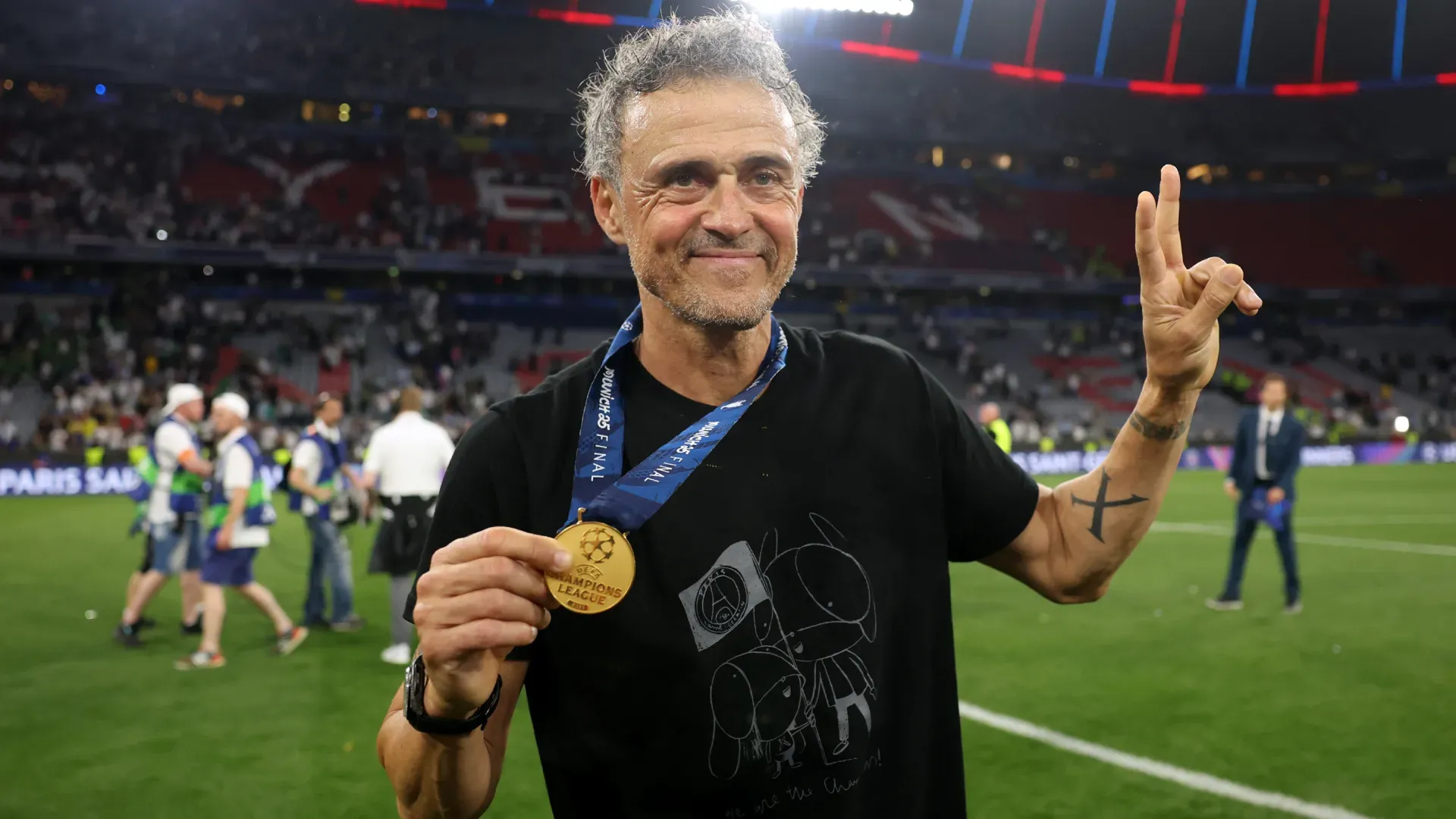 Luis Enrique poses with a medal