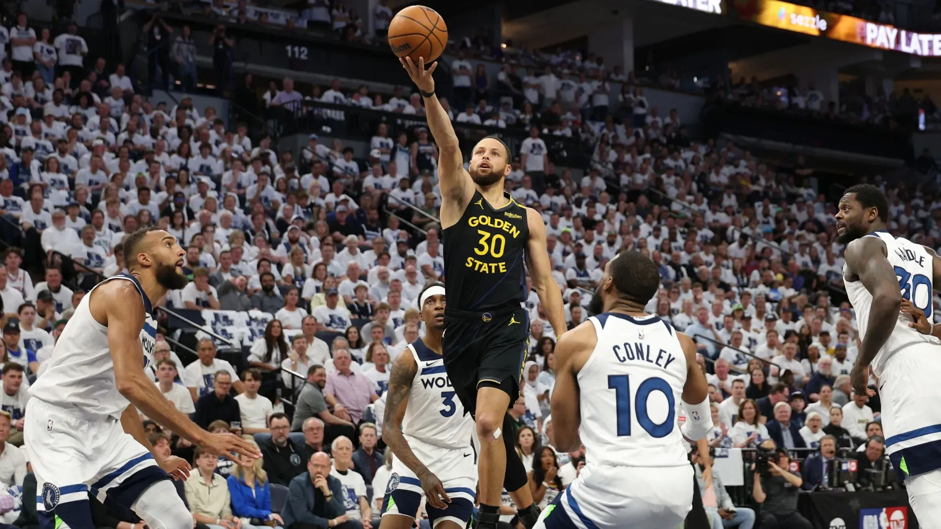 Stephen Curry takes a shot against Mike Conley during the first quarter in Game One of the Western Conference Second Round NBA Playoffs.