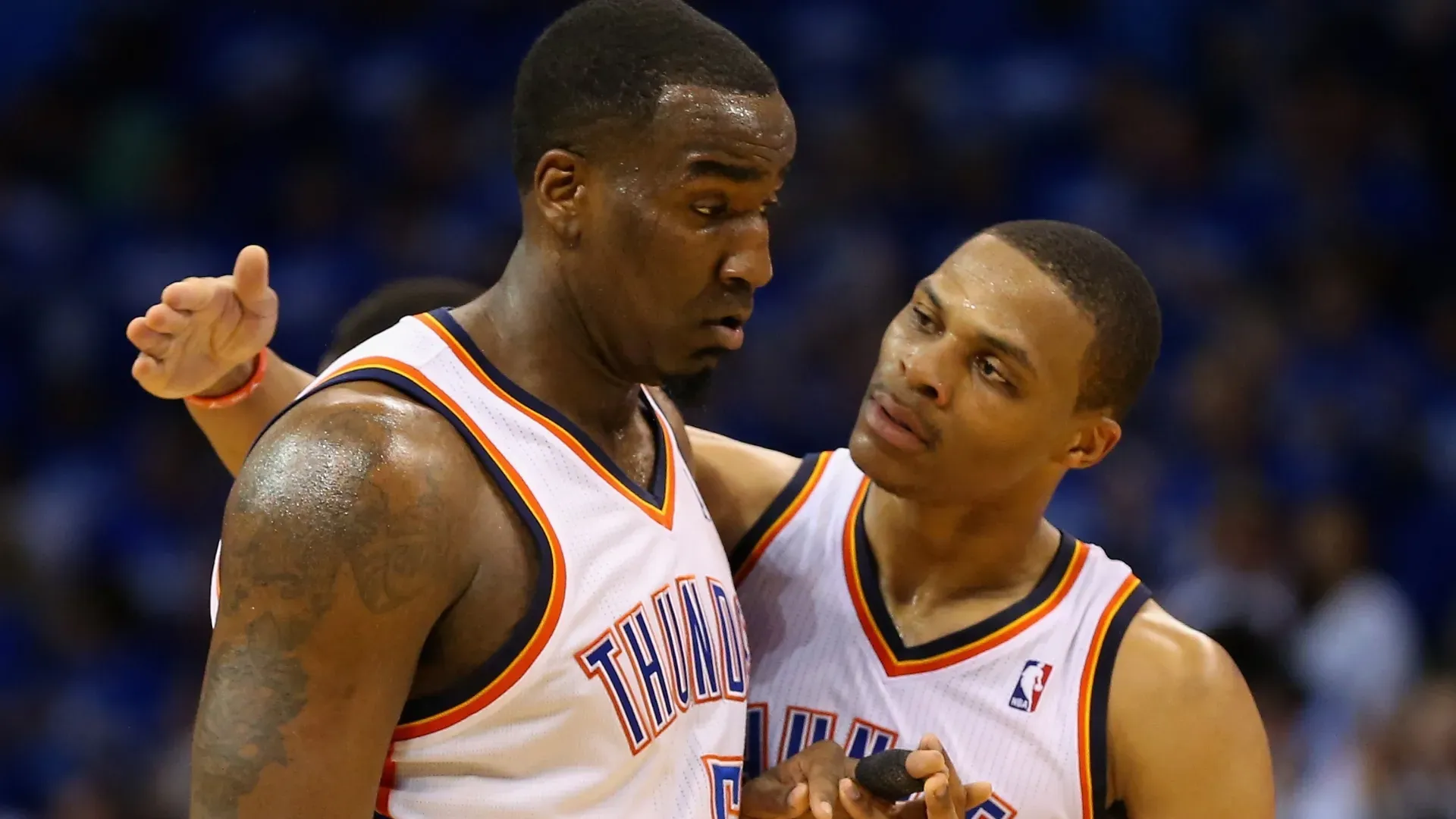 Kendrick Perkins and Russell Westbrook playing with the Oklahoma City Thunder during the 2013-14 NBA season.