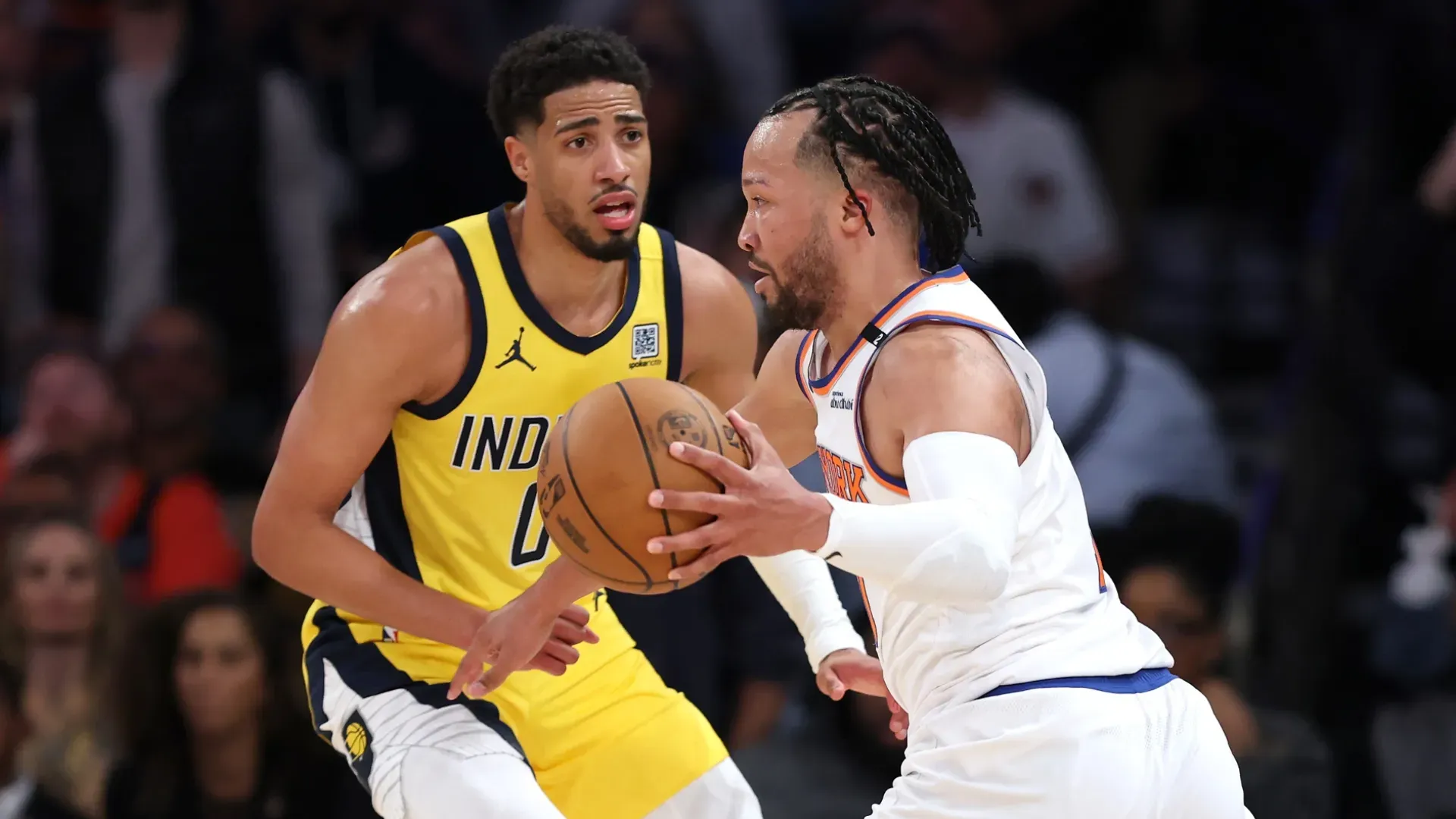 Jalen Brunson of the New York Knicks is defended by Tyrese Haliburton of the Indiana Pacers