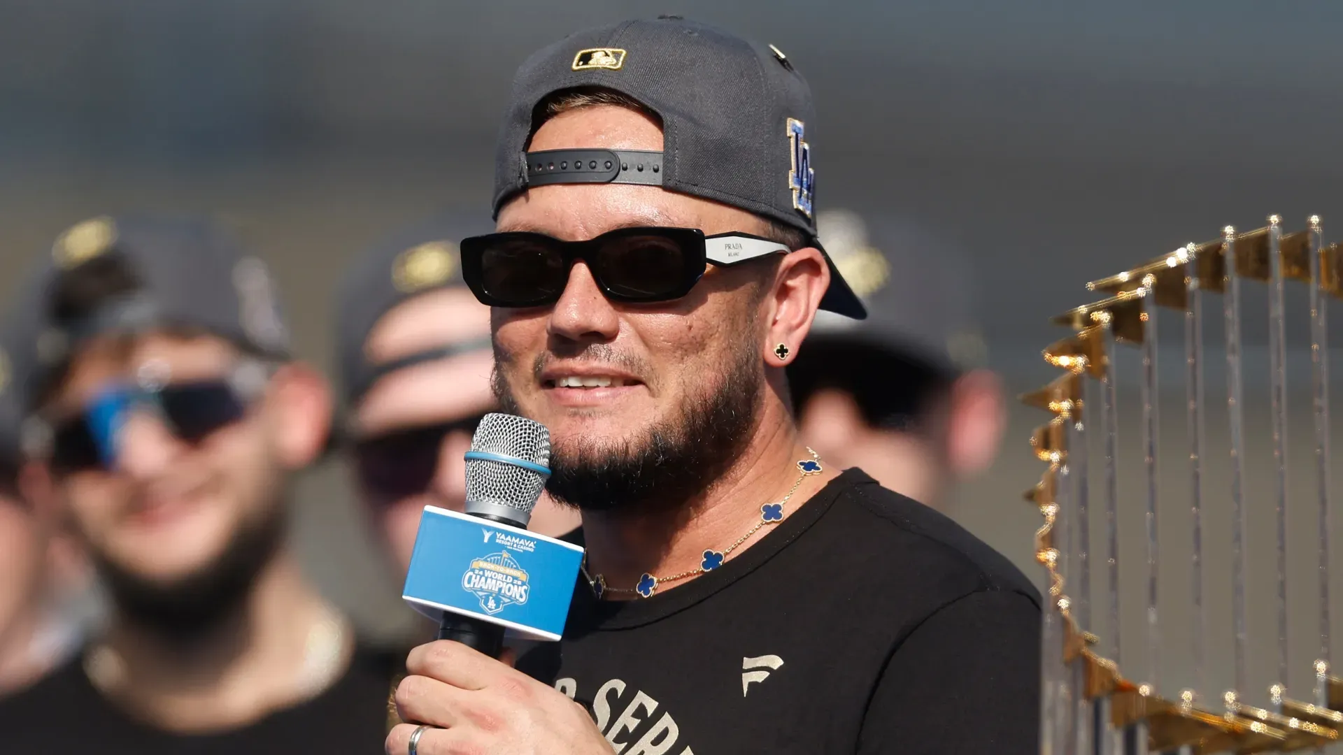 Miguel Rojas #72 of the Dodgers speaks to the crowd during the 2025 Dodgers World Series Celebration. Ronald Martinez/Getty Images