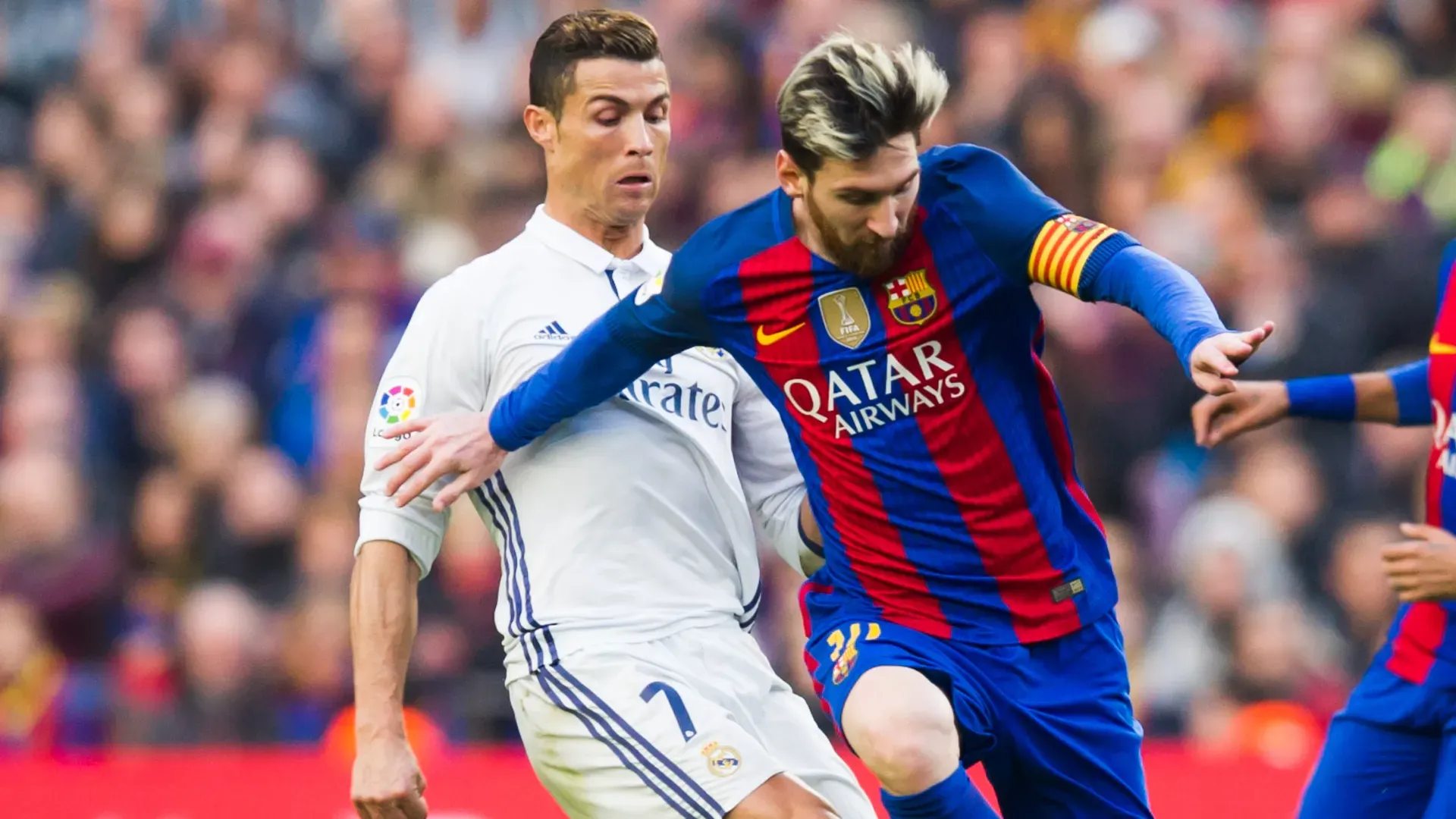 Lionel Messi and Cristiano Ronaldo during a Real Madrid vs Barcelona game.