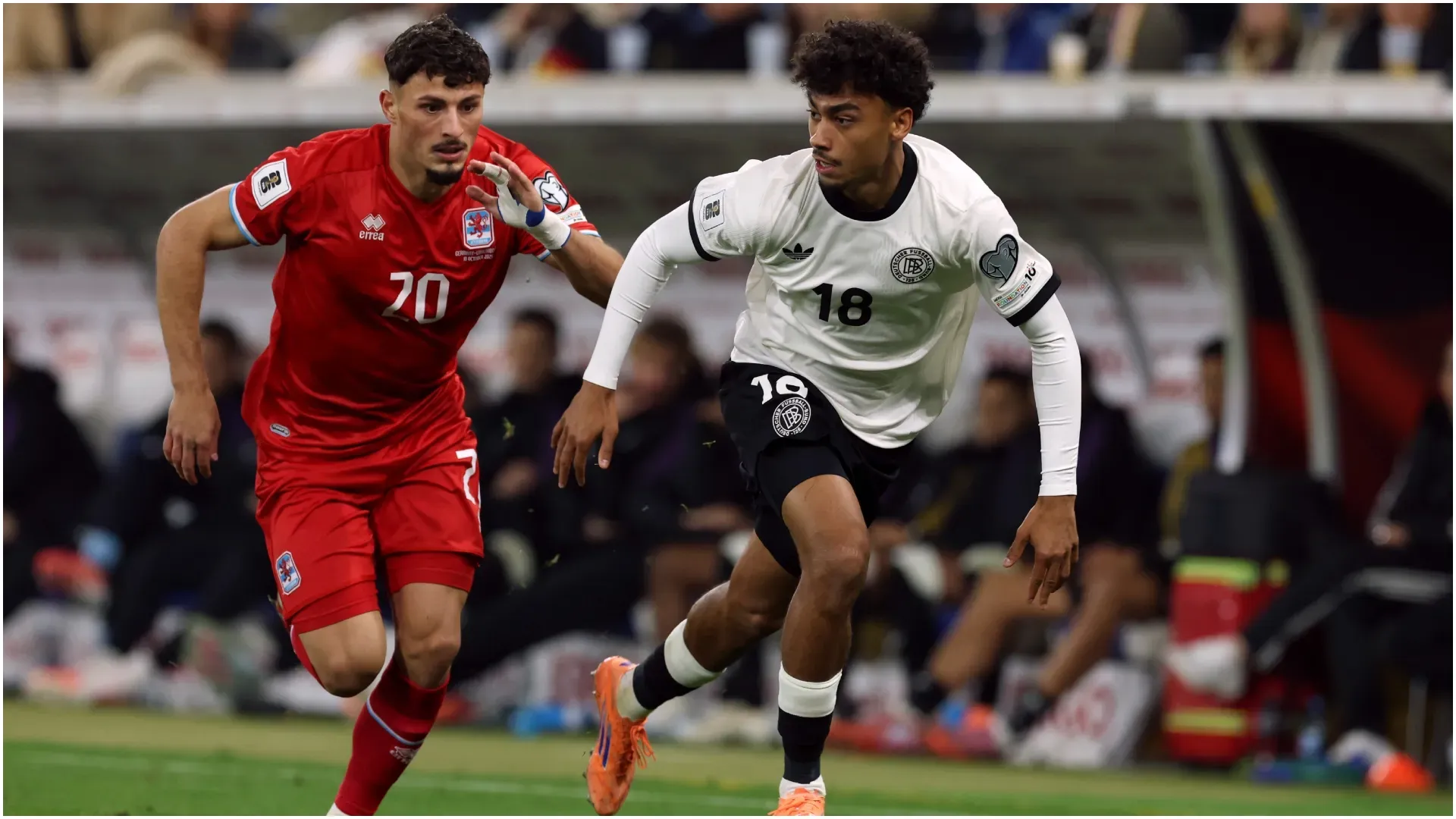 Nathaniel Brown of Germany runs with the ball whilst under pressure from Eldin Dzogovic of Luxembourg – Alexander Hassenstein/Getty Images