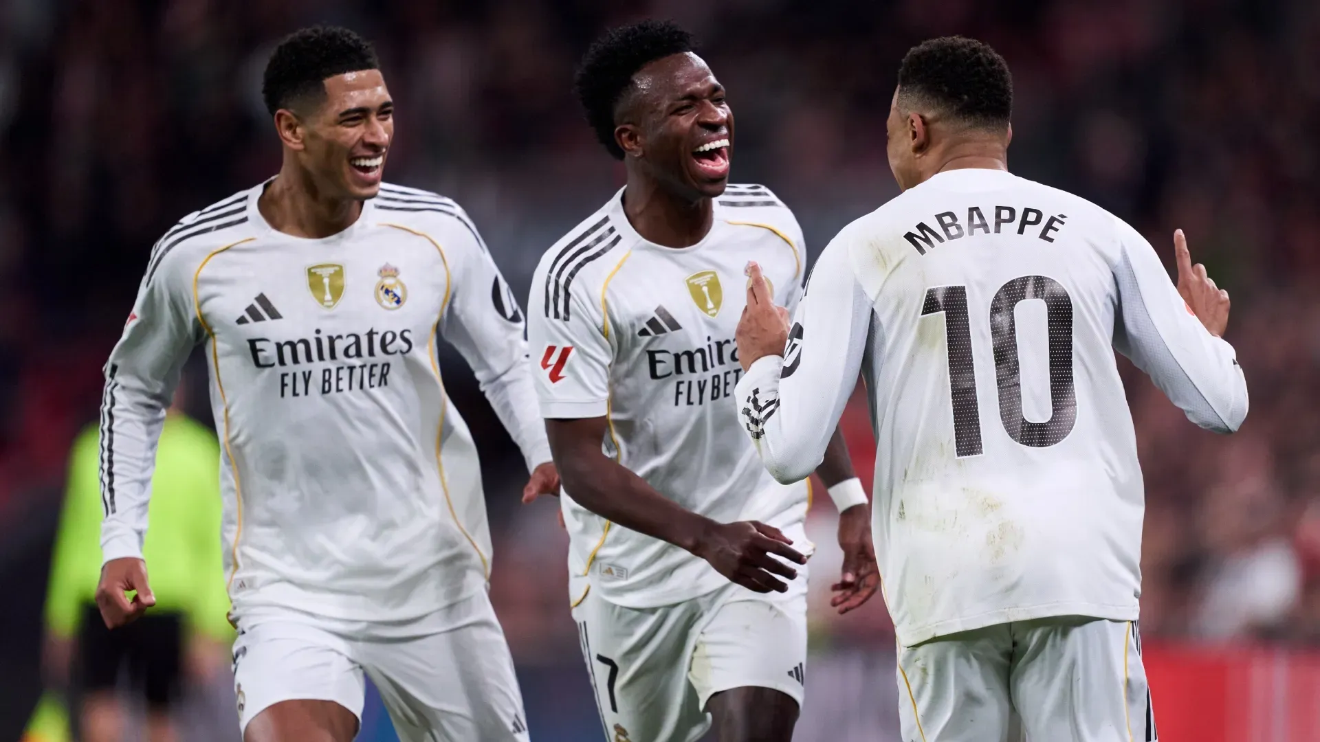 Kylian Mbappe of Real Madrid celebrates scoring his team’s third goal with teammates Vinicius and Bellingham. Juan Manuel Serrano Arce/Getty Images)