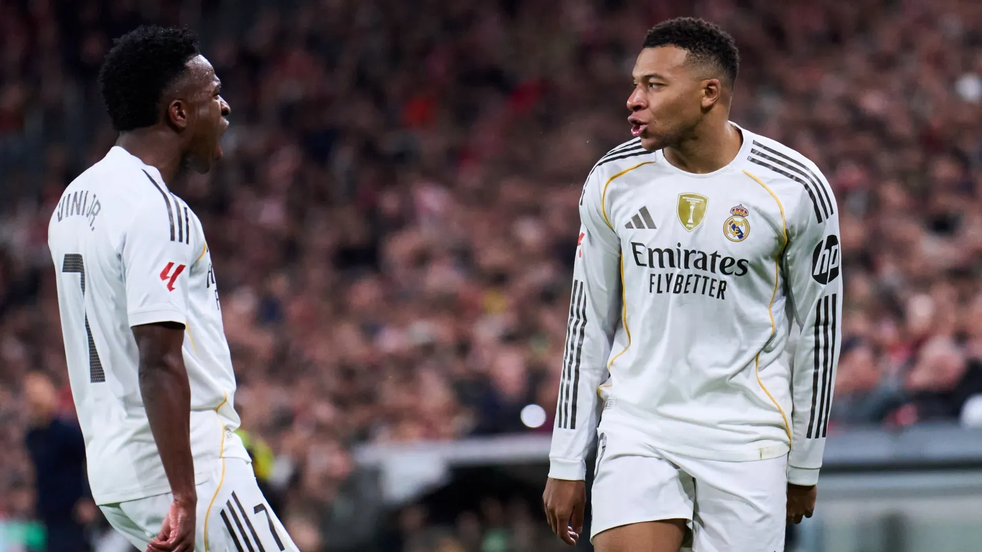 : Kylian Mbappe of Real Madrid celebrates scoring his team’s first goal with teammate Vinicius Junior. Juan Manuel Serrano Arce/Getty Images