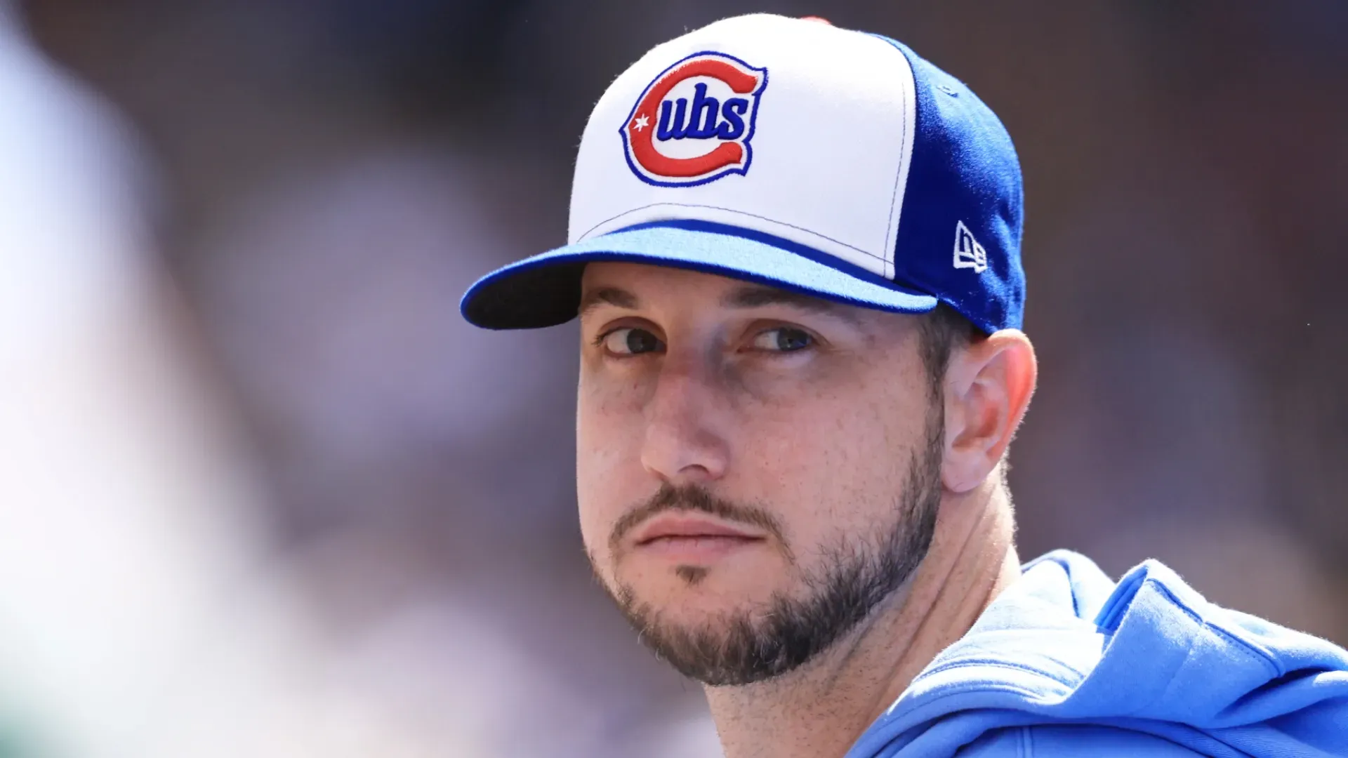 Kyle Tucker looks on