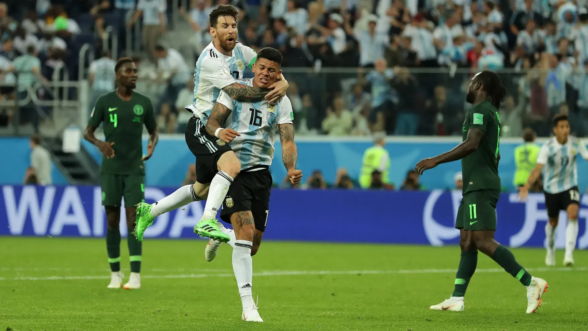 Marcos Rojo celebrates with Lionel Messi after scoring a crucial goal for Argentina against Nigeria during the 2018 FIFA World Cup.