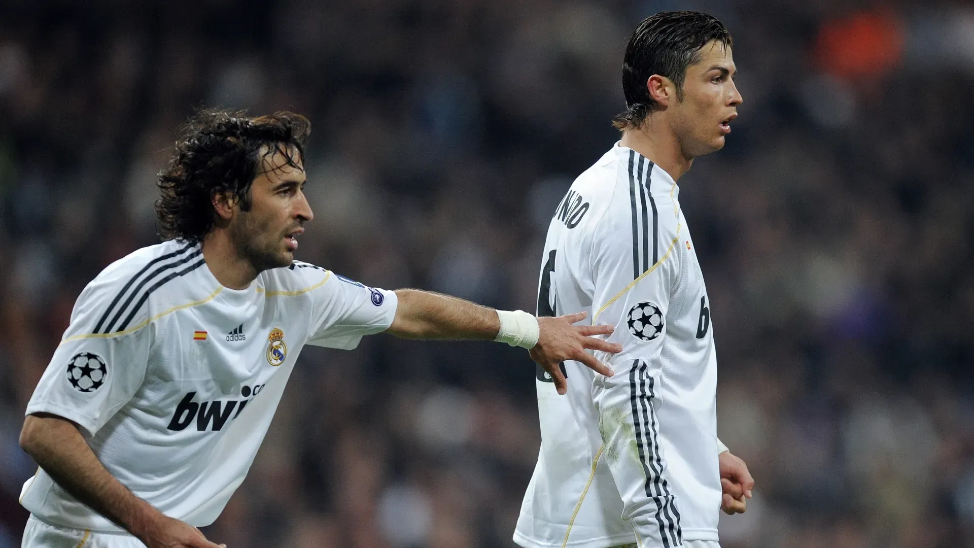 Raul Gonzalez and Cristiano Ronaldo playing for Real Madrid.