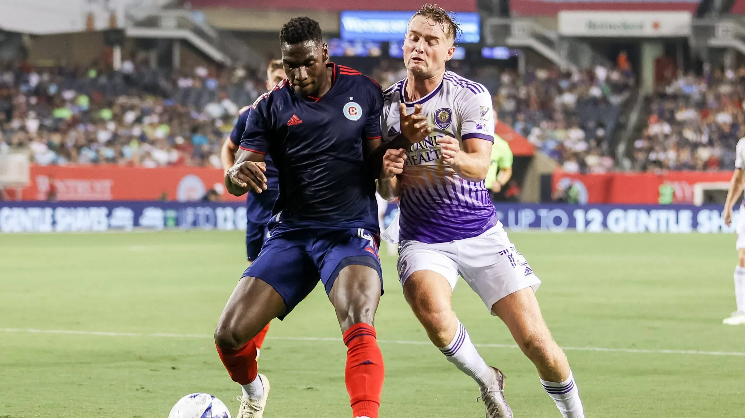 Chicago, USA, August 20, 2023: Duncan McGuire 13 Orlando City SC fouls Carlos Teran 4 Chicago Fire FC during the game between Chicago Fire FC and Orlando City SC on Sunday August 20, 2023 at Soldier Field, Chicago, USA. NO COMMERCIAL USAGE Shaina Benhiyoun/SPP PUBLICATIONxNOTxINxBRAxMEX Copyright: xShainaxBenhiyoun/SPPx spp-en-ShBe-590A1289