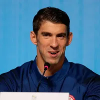 Why is Michael Phelps not competing at the Paris 2024 Olympic Games?