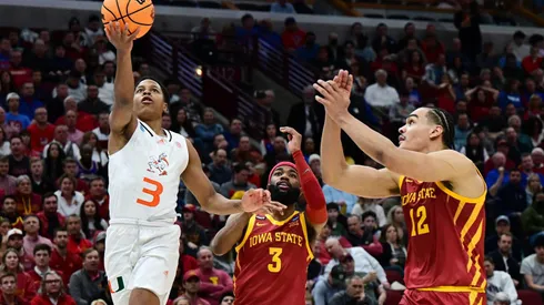 CHICAGO, ILLINOIS - MARCH 25: Charlie Moore #3 of the Miami Hurricanes drives to the basket against Tre Jackson #3 and Robert Jones #12 of the Iowa State Cyclones during the first half in the Sweet Sixteen round game of the 2022 NCAA Men's Basketball Tournament at United Center on March 25, 2022 in Chicago, Illinois. (Photo by Quinn Harris/Getty Images)