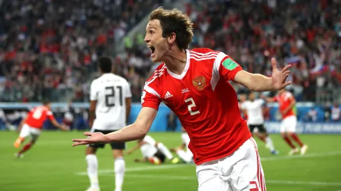 SAINT PETERSBURG, RUSSIA – JUNE 19:  Mario Fernandes of Russia celebrates the 2nd Russia goal scored by Denis Cheryshev of Russia during the 2018 FIFA World Cup Russia group A match between Russia and Egypt at Saint Petersburg Stadium on June 19, 2018 in Saint Petersburg, Russia.  (Photo by Julian Finney/Getty Images)
