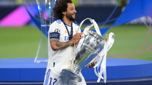PARIS, FRANCE - MAY 28: Marcelo of Real Madrid celebrates with the UEFA Champions League Trophy after their sides victory in the UEFA Champions League final match between Liverpool FC and Real Madrid at Stade de France on May 28, 2022 in Paris, France. (Photo by Shaun Botterill/Getty Images)