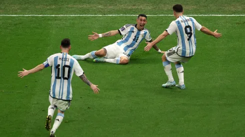 LUSAIL CITY, QATAR – DECEMBER 18: Angel Di Maria of Argentina celebrates with Julian Alvarez and Lionel Messi after scoring the team's second goal past Hugo Lloris of France during the FIFA World Cup Qatar 2022 Final match between Argentina and France at Lusail Stadium on December 18, 2022 in Lusail City, Qatar. (Photo by Alex Pantling/Getty Images)
