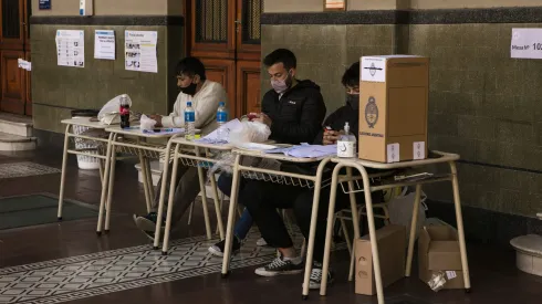 BUENOS AIRES, ARGENTINA, SEPTEMBER 12: Polling station authorities wait for citizens to cast their vote during midterm primary elections on September 12, 2021 in Buenos Aires, Argentina. With health protocols and restrictions to prevent contagion Argentinians are heading to polls amid the COVID-19 pandemic. (Photo by Ricardo Ceppi / Getty Images)
