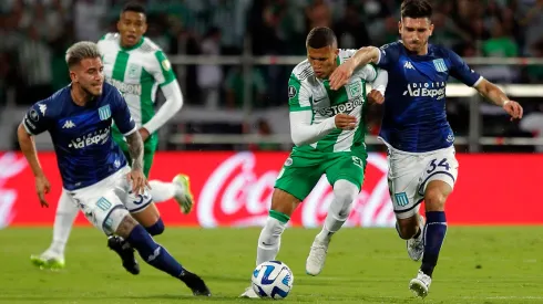 Atletico Nacional's midfielder Nelson Deossa (C) fights for the ball with Racing's defender Gonzalo Piovi (L) and defender Facundo Mura during the Copa Libertadores round of 16 first leg football match between Colombia's Atletico Nacional and Argentina's Racing Club at the Atanasio Girardot stadium in Medellin, Colombia, on August 3, 2023. (Photo by Fredy BUILES / AFP) (Photo by FREDY BUILES/AFP via Getty Images)
