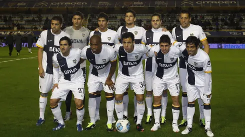 Oscar Ustari junto a Román Riquelme en su paso por Boca.
