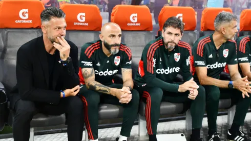 Javier Pinola junto a Martín Demichelis y Germán Lux.