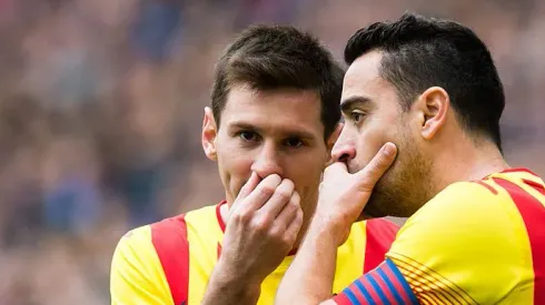 BARCELONA, SPAIN – MARCH 29: Lionel Messi (L) and Xavi Hernandez of FC Barcelona speak during the La Liga match between RCD Espanyol and FC Barcelona at Cornella-El Prat Stadium on March 29, 2014 in Barcelona, Spain. (Photo by Alex Caparros/Getty Images)

