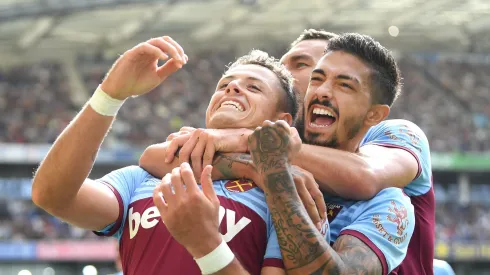 BRIGHTON, ENGLAND - AUGUST 17: Javier Hernandez of West Ham United celebrates with team mates Manuel Lanzini and Robert Snodgrass after scoring his team's first goal during the Premier League match between Brighton & Hove Albion and West Ham United at American Express Community Stadium on August 17, 2019 in Brighton, United Kingdom. (Photo by Mike Hewitt/Getty Images)
