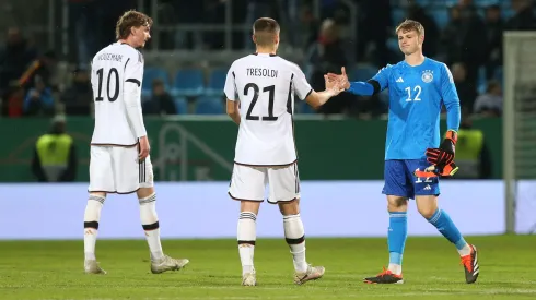 Nick Woltemade, Nicolo Tresoldi and Jonas Urbig (L-R) of Germany look on after the UEFA Under 21 EURO Qualifier match between Germany U21 and Kosovo U21 at Stadion an der Gellertstrasse on March 22, 2024 in Chemnitz, Germany. (Photo by Matthias Kern/Getty Images)
