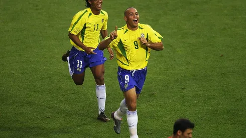 ULSAN - JUNE 3: Ronaldo (left) of Brazil celebrates scoring the equalising goal against Turkey with team mate Ronaldinho during the Group C match of the World Cup Group Stage played at the Ulsan-Munsu World Cup Stadium, Ulsan, South Korea on June 3, 2002. Brazil won the match 2-1. (Photo by Clive Brunskill/Getty Images)