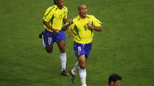 ULSAN – JUNE 3:  Ronaldo (left) of Brazil celebrates scoring the equalising goal against Turkey with team mate Ronaldinho during the Group C match of the World Cup Group Stage played at the Ulsan-Munsu World Cup Stadium, Ulsan, South Korea on June 3, 2002.  Brazil won the match 2-1. (Photo by Clive Brunskill/Getty Images)
