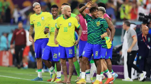 DOHA, QATAR - DECEMBER 05: Vinicius Junior, Neymar and Fred of Brazil acknowledge the fans after the team's victory during the FIFA World Cup Qatar 2022 Round of 16 match between Brazil and South Korea at Stadium 974 on December 05, 2022 in Doha, Qatar. (Photo by Buda Mendes/Getty Images)