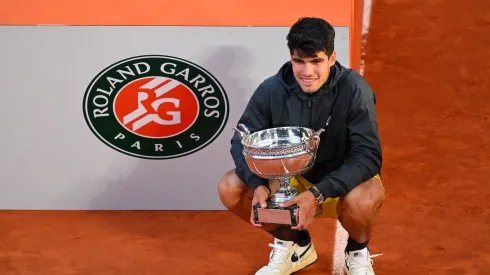 PARIS, FRANCE – JUNE 09: Carlos Alcaraz of Spain celebrates with the winners trophy after victory in the Men's Singles Final match between Alexander Zverev of Germany and Carlos Alcaraz of Spain on Day 15 of the 2024 French Open at Roland Garros on June 09, 2024 in Paris, France. (Photo by Tim Goode/Getty Images)
