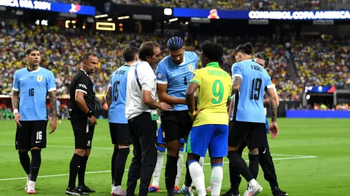 LAS VEGAS, NEVADA - JULY 06: Ronald Araujo of Uruguay leaves the pitch after suffering an injury during the CONMEBOL Copa America 2024 quarter-final match between Uruguay and Brazil at Allegiant Stadium on July 06, 2024 in Las Vegas, Nevada. (Photo by Candice Ward/Getty Images)