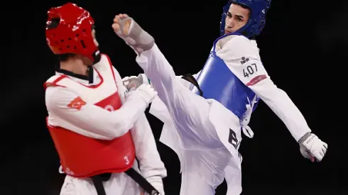 CHIBA, JAPAN – JULY 25: Edival Pontes (R) of Team Brazil competes against Hakan Recber of Team Turkey during the Men's -68kg Taekwondo Round of 16 contest on day two of the Tokyo 2020 Olympic Games at Makuhari Messe Hall on July 25, 2021 in Chiba, Japan. (Photo by Maja Hitij/Getty Images)
