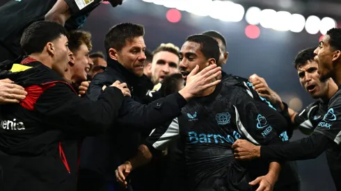 STUTTGART, GERMANY – MARCH 16: Xabi Alonso, Head Coach of Bayer 04 Leverkusen, embraces his player Arthur after their side's victory in the Bundesliga match between VfB Stuttgart and Bayer 04 Leverkusen at MHPArena on March 16, 2025 in Stuttgart, Germany. (Photo by Daniel Kopatsch/Getty Images)