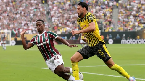EAST RUTHERFORD, NEW JERSEY – JUNE 17: Ramy Bensebaini #5 of Borussia Dortmund controls the ball against Jhon Arias #21 of Fluminense FC during the FIFA Club World Cup 2025 group F match between Fluminense FC and Borussia Dortmund at MetLife Stadium on June 17, 2025 in East Rutherford, New Jersey. (Photo by Francois Nel/Getty Images)
