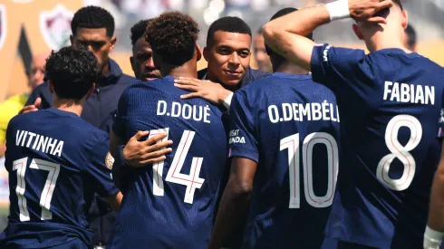EAST RUTHERFORD, NEW JERSEY – JULY 09: Kylian Mbappe #9 of Real Madrid C.F. embraces Desire Doue #14 of Paris Saint-Germain prior to the FIFA Club World Cup 2025 semi-final match between Paris Saint-Germain and Real Madrid CF at MetLife Stadium on July 09, 2025 in East Rutherford, New Jersey. (Photo by David Ramos/Getty Images)
