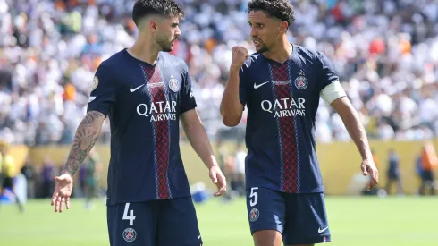 EAST RUTHERFORD, NEW JERSEY – JULY 09: Lucas Beraldo and Marquinhos #5 of Paris Saint-Germain interact during the FIFA Club World Cup 2025 semi-final match between Winner Game 59 and Winner Game 60 at MetLife Stadium on July 09, 2025 in East Rutherford, New Jersey. (Photo by Alex Grimm/Getty Images)