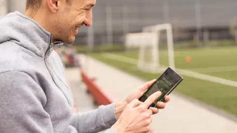 Man using online sports betting services on phone
