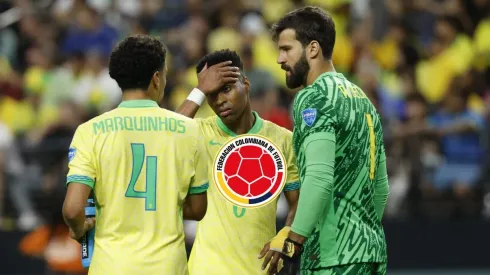 Marquinhos con Alisson Becker.
