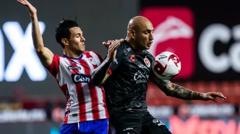 TIJUANA, MEXICO – AUGUST 12:Ramiro Gonzalez of Atletico San Luis and Ariel Nahuelpan of Tijuana compete for the ball during the 4th round match between Tjuana and Atletico San Luis as part of the Torne Guard1anes 2020 Liga MX at Caliente Stadium on August 12, 2020 in Tijuana, Mexico. (Photo by Francisco Vega/Getty Images)-Not Released (NR)
