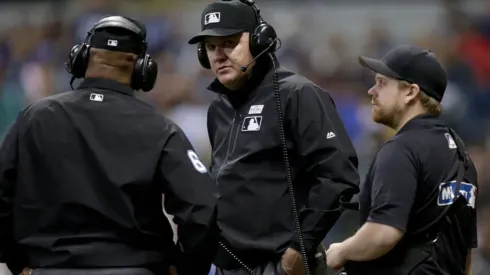 MLB umpires reviewing a call. (Getty)
