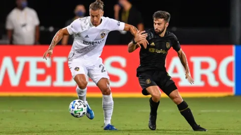 LAFC vs. LA Galaxy: Rolf Feltscher of LA Galaxy (left) turns away from Diego Rossi of LAFC (Getty).
