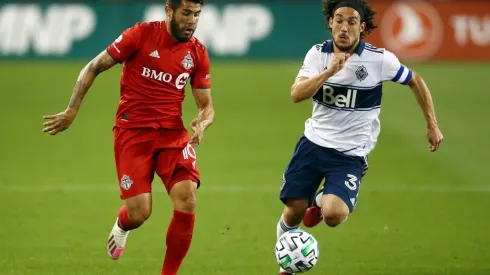 Vancouver Whitecaps vs. Toronto FC: Alejandro Pozuelo of Toronto FC (left) and Russell Teibert of the Whitecaps fight for the ball (Getty).
