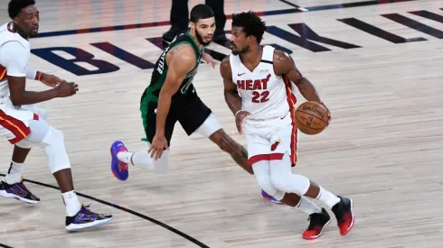 Jimmy Butler dribbles past Jayson Tatum. (Getty)
