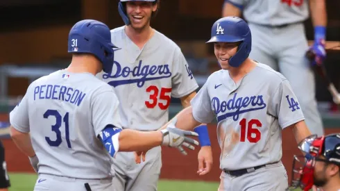 Cody Bellinger #35 and Will Smith #16 congratulate Joc Pederson #31 after hitting a 3-run homer. (Getty)
