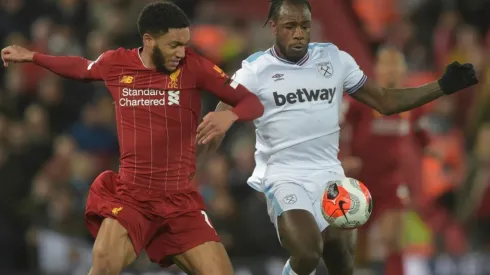 Michail Antonio of West Ham United (right) in action with Joe Gomez of Liverpool (left). (Getty)
