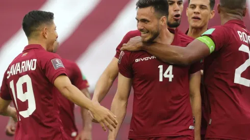 Luis Mago (center) celebrates after scoring Venezuela's first goal against Chile. (Getty)
