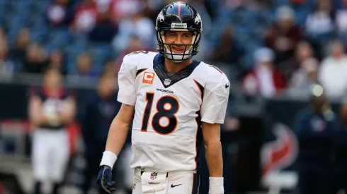 Peyton Manning #18 of the Denver Broncos celebrates after throwing his fourth touchdown during the game against the Houston Texans at Reliant Stadium on December 22, 2013.
