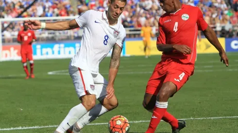 Clint Dempsey (left) fights for the ball during USA's 6-0 win over Cuba in 2015. (Getty)
