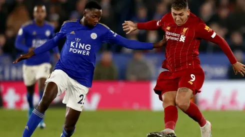 Roberto Firmino (right) and Wilfred Ndidi (left) in action during the Premier League match between Leicester City and Liverpool. (Getty)
